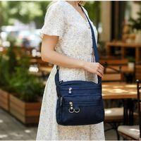 Fiyra ç2 Lacivert Beş Gözlü Krinkıl Kumaş Bayan Çapraz Omuz Çanta