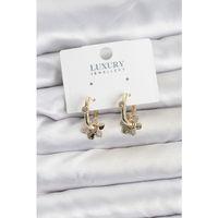 Zirkon Taşlı Pirinç Kadın Göçmen Küpesi