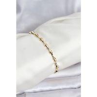 Pirinç Gold Renk VIP Seri Kemik Model Zirkon Taşlı Kadın Bileklik