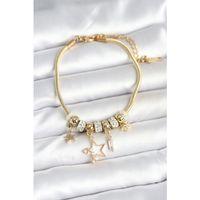Pirinç Gold Renk Yıldız Charmlı Kadın Bileklik