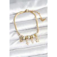 Pirinç Gold Renk Kutup Yıldızı Charmlı Kadın Bileklik - TJ-BB7991
