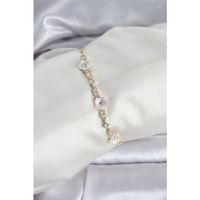 Baget Zirkon Taşlı Çiçek Model Gold Renk Asansörlü Kadın Bileklik