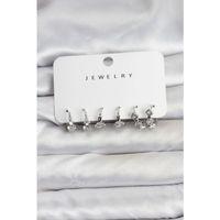 Gümüş Renk Pirinç Yıldız Modelli Kadın Küpe Seti